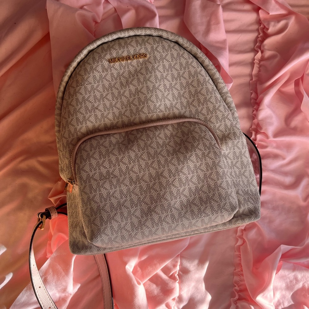 Used Michael Kors pink and off white backpack